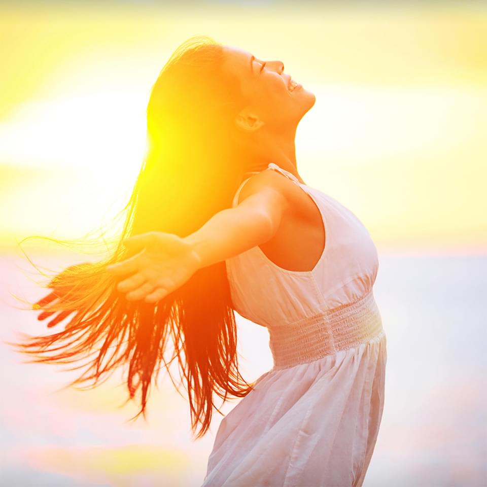 Photo of young woman enjoying sunshine